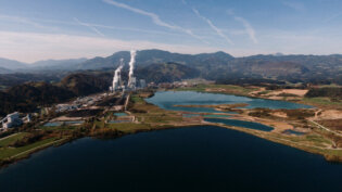 landscape surrounded by mountains lakes with industrial disaster