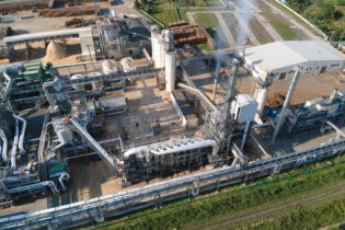 aerial view oil gas refining petrochemical factory with tall refinery plant manufacture structure